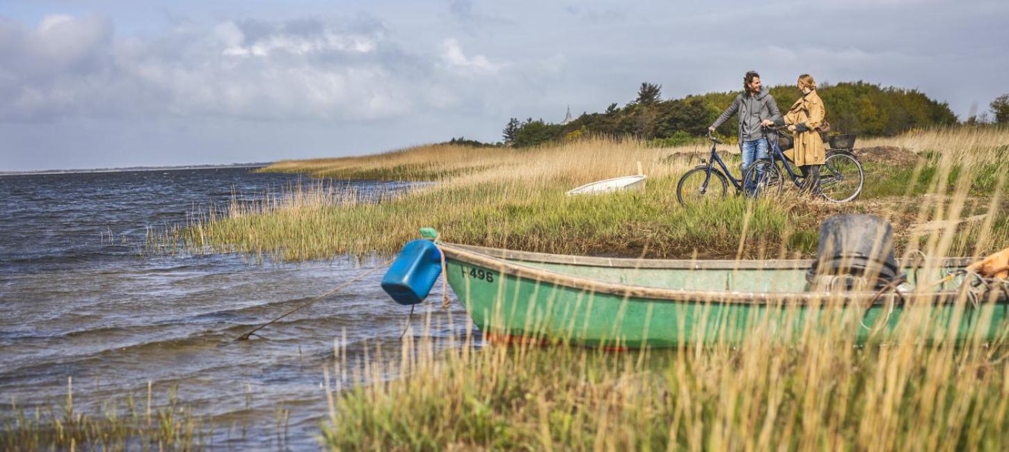 Couple on a bike ride by Ringkøbing Fjord