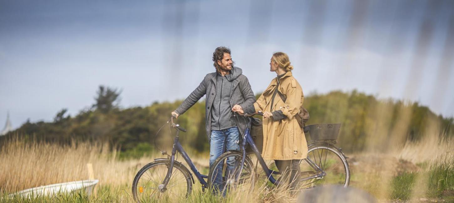 Couple on a bike ride by Ringkøbing Fjord