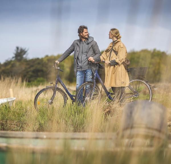 Couple on a bike ride by Ringkøbing Fjord